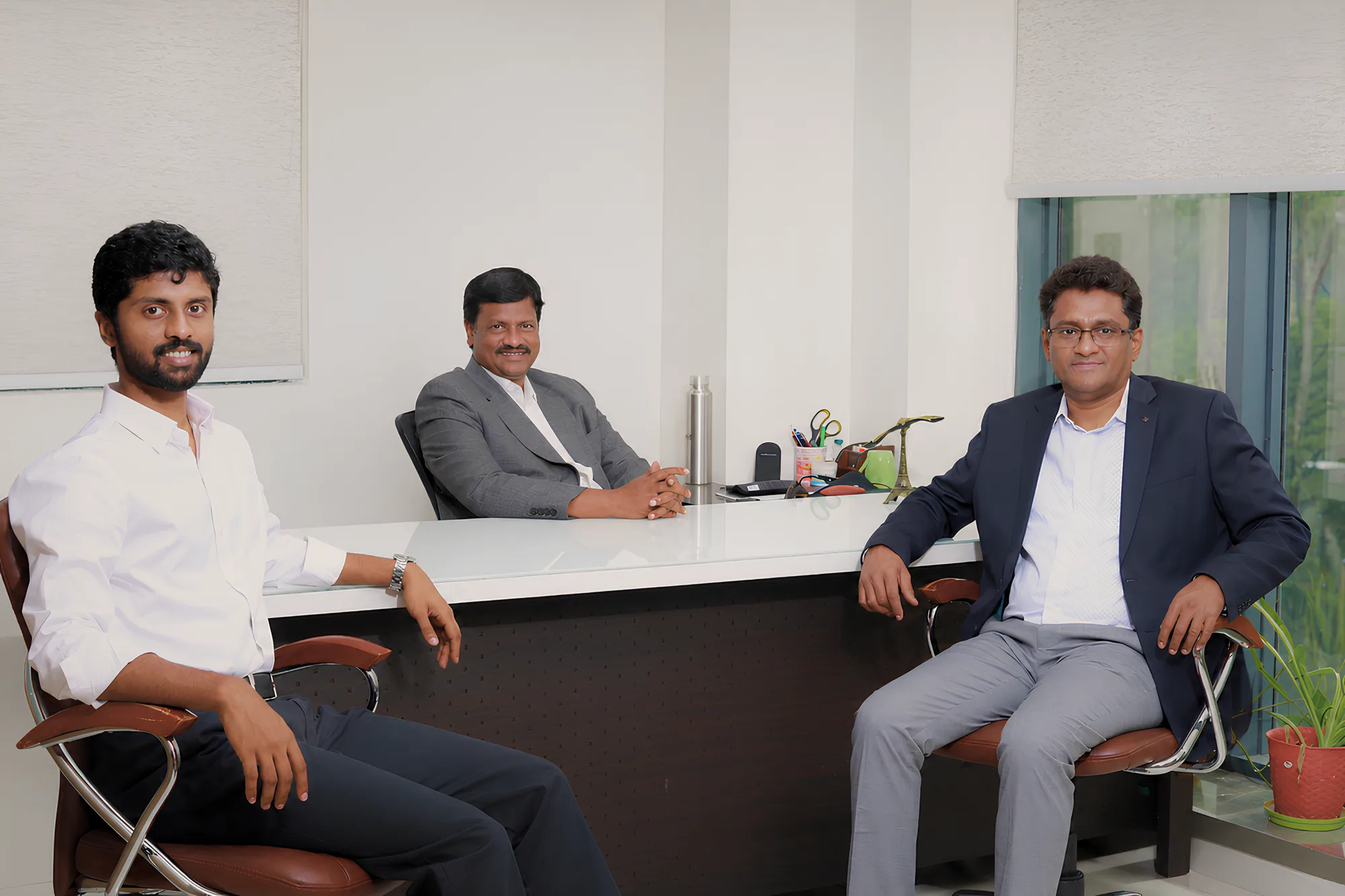 Servefar team seated together in the office